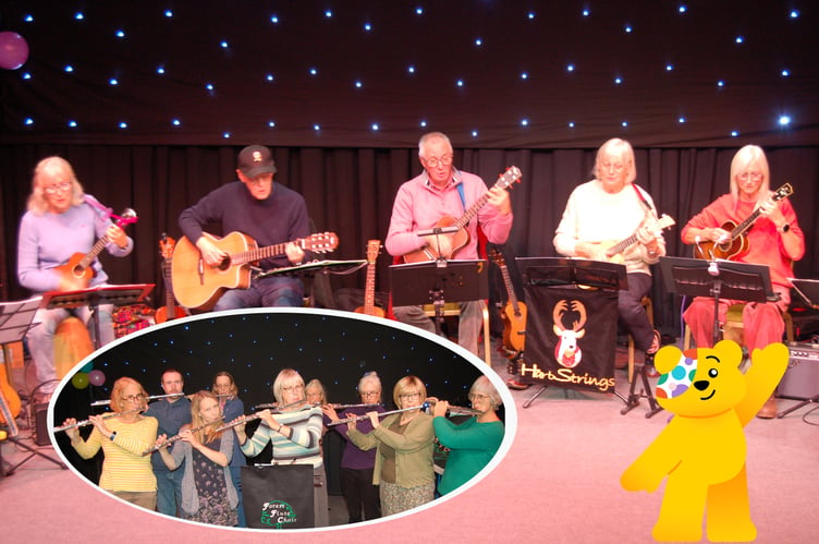 Ukulele musicians group Hart Strings and inset the flautists from the Forest Flute Choir