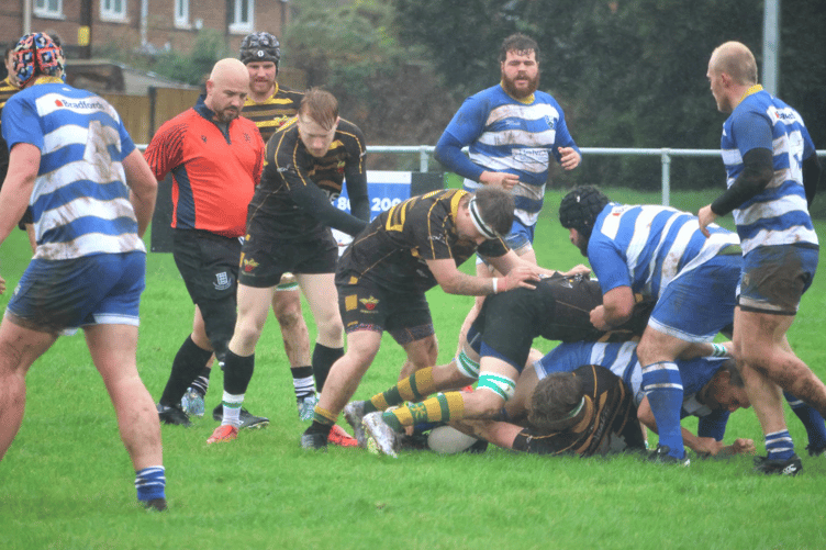 Ross in blue and white battle for possession